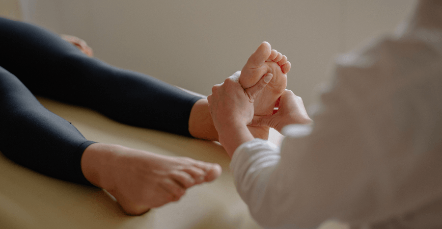 Medical Consultation with doctor examining foot