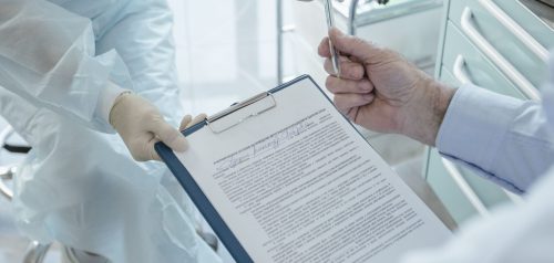 Doctor and patient with medical document