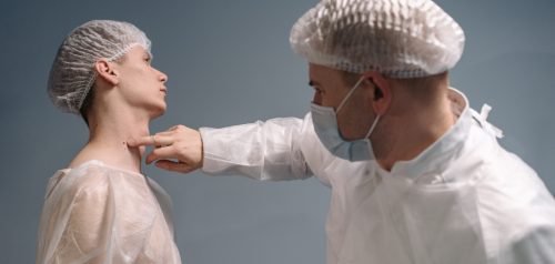 Doctor assessing patient's skin