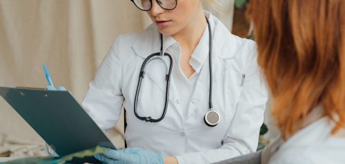Doctor checking patient during ongoing care