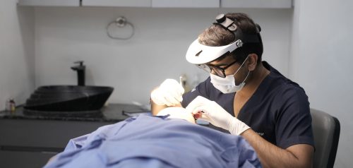 Doctor performing skin treatment