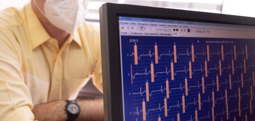 Doctor reviewing heart-monitor readings