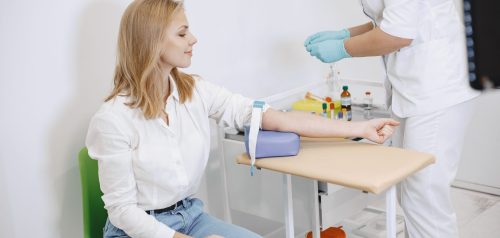 Nurse taking blood sample
