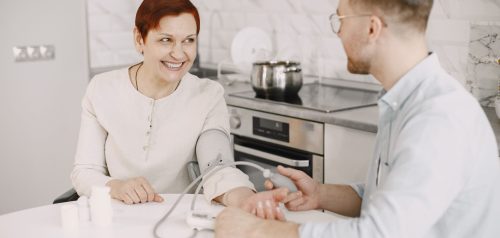 Patient's blood pressure being checked