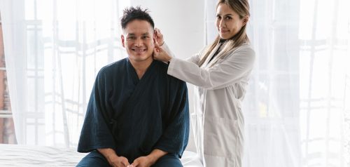 Smiling doctor and patient