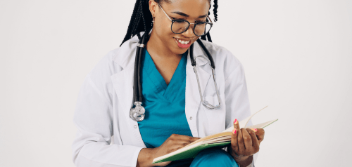 smiling doctor reading documents